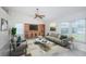 Bright living room features neutral colors, modern furniture, and a ceiling fan at 10906 Kenbrook Dr, Riverview, FL 33578