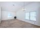 Bright living room with vaulted ceilings, chandelier, and lots of natural light at 10906 Kenbrook Dr, Riverview, FL 33578