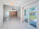 Open layout showcasing sliding door to back patio with view into the living room at 10906 Kenbrook Dr, Riverview, FL 33578