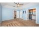 Spacious main bedroom featuring carpeted floors, access to a bathroom, and a closet, ensuring comfort and convenience at 10906 Kenbrook Dr, Riverview, FL 33578