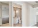 View into a bathroom with a single vanity, toilet, and a glass enclosed shower at 11147 Brambleleaf Way, Hudson, FL 34667