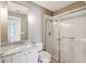This bathroom offers granite counters, ample cabinets and a shower with sliding glass doors at 11147 Brambleleaf Way, Hudson, FL 34667
