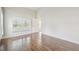 Bedroom with wood floors, large window, and ample natural light, freshly painted at 11147 Brambleleaf Way, Hudson, FL 34667