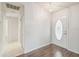 Bright foyer featuring hardwood floors and a decorative front door at 11147 Brambleleaf Way, Hudson, FL 34667