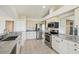 Bright kitchen features stainless appliances, granite countertops, and ample cabinetry at 11147 Brambleleaf Way, Hudson, FL 34667
