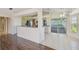 Kitchen featuring stainless appliances, breakfast bar, tile floors, and sliding glass doors to outdoor area at 11147 Brambleleaf Way, Hudson, FL 34667