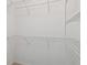 Empty walk-in closet with wire shelving, ready for storage and organization at 11147 Brambleleaf Way, Hudson, FL 34667