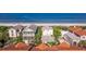 Stunning aerial view of beach homes with ocean views and private balconies in a desirable coastal neighborhood location at 1206 Gulf Blvd # C, Indian Rocks Beach, FL 33785