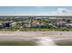 Incredible aerial view shows beachfront property on the beach and nearby community in distance at 1206 Gulf Blvd # C, Indian Rocks Beach, FL 33785