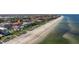 Fantastic aerial view showcases beachfront property next to a beautiful beach with community nearby at 1206 Gulf Blvd # C, Indian Rocks Beach, FL 33785