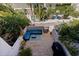 Private backyard patio with outdoor sectional seating and a grill, perfect for entertaining at 1206 Gulf Blvd # C, Indian Rocks Beach, FL 33785
