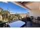 Relaxing balcony with outdoor seating and views of the neighborhood and a clear blue sky at 1206 Gulf Blvd # C, Indian Rocks Beach, FL 33785