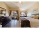Bright bedroom with a high vaulted ceiling, dark hardwood floors, and an exterior view at 1206 Gulf Blvd # C, Indian Rocks Beach, FL 33785