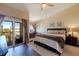 Bright bedroom with a high vaulted ceiling, dark hardwood floors, and exterior views at 1206 Gulf Blvd # C, Indian Rocks Beach, FL 33785