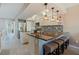 This kitchen boasts stainless steel appliances, granite countertops, a breakfast bar, and views of the dining area at 1206 Gulf Blvd # C, Indian Rocks Beach, FL 33785