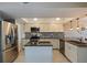 This modern kitchen features stainless steel appliances, granite countertops, and a breakfast bar at 1206 Gulf Blvd # C, Indian Rocks Beach, FL 33785
