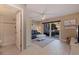 Relaxing living room with tile floors, slider to patio, bathroom access, couch and ceiling fan at 1206 Gulf Blvd # C, Indian Rocks Beach, FL 33785