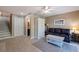 Relax in this cozy living room with wood floors, an armoire, and a leather sofa at 1206 Gulf Blvd # C, Indian Rocks Beach, FL 33785