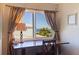 Office with a hardwood desk, curtains, and exterior views at 1206 Gulf Blvd # C, Indian Rocks Beach, FL 33785