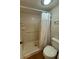 Bathroom with a shower, toilet, and grab bar at 125 S Wiggins Rd, Plant City, FL 33566