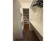 Walk-in closet with hardwood floors, shelves, and hanging rods at 125 S Wiggins Rd, Plant City, FL 33566