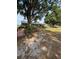 Charming single-story home with a metal roof, stone siding, and a walkway leading up to the front entrance at 125 S Wiggins Rd, Plant City, FL 33566
