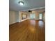 Spacious living room featuring hardwood floors and a ceiling fan at 125 S Wiggins Rd, Plant City, FL 33566