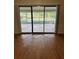 Living space with sliding glass doors that open up to a screened pool area, seamlessly connecting indoor and outdoor living at 125 S Wiggins Rd, Plant City, FL 33566