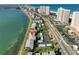 Aerial view of waterfront condo community featuring well-manicured lawns and convenient parking at 1301 Gulf Blvd # 107, Clearwater Beach, FL 33767