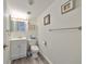 Bathroom with a white vanity, toilet and tile floors at 1301 Gulf Blvd # 107, Clearwater Beach, FL 33767