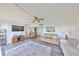 Open-concept living area showcasing stylish decor, dining area and a view into the modern kitchen at 1301 Gulf Blvd # 107, Clearwater Beach, FL 33767