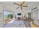 Bright living room featuring sliding glass doors to the water and comfortable seating at 1301 Gulf Blvd # 107, Clearwater Beach, FL 33767