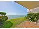 Relaxing patio overlooking the ocean with well-manicured landscaping and peaceful views at 1301 Gulf Blvd # 107, Clearwater Beach, FL 33767