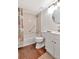 Cozy bathroom featuring a vanity with a mirror, toilet, and bathtub shower at 1400 Pine Glen Ln # B2, Tarpon Springs, FL 34688