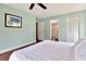 Bedroom with aqua walls, queen bed, and en suite bathroom with closet at 1400 Pine Glen Ln # B2, Tarpon Springs, FL 34688