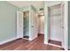 Bedroom featuring hardwood floors with ample storage space with closets at 1400 Pine Glen Ln # B2, Tarpon Springs, FL 34688