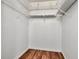 Walk-in closet with wire shelving and wood floor at 1400 Pine Glen Ln # B2, Tarpon Springs, FL 34688