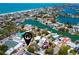 An aerial view of the property shows neighborhood, beach and waterways of the surrounding area at 1507 Legion Ln, Indian Rocks Beach, FL 33785