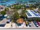 Charming single-Gathering home featuring a cozy front porch and well-maintained landscaping, complemented by solar panels nearby at 1507 Legion Ln, Indian Rocks Beach, FL 33785