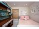 Bedroom displaying a decorative coral mirror and bamboo shades at 1507 Legion Ln, Indian Rocks Beach, FL 33785