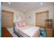 Bedroom featuring a decorative coral mirror and bamboo shades at 1507 Legion Ln, Indian Rocks Beach, FL 33785