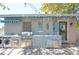 A covered outdoor kitchen area is equipped with a built-in grill, countertop, and storage at 1507 Legion Ln, Indian Rocks Beach, FL 33785