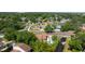 High angle aerial view showcases the home nestled within a lush, tree-filled neighborhood at 1700 Azalea Ct # B, Oldsmar, FL 34677