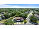 Aerial view of townhome complex surrounded by lush greenery and landscaping in a quiet residential neighborhood at 1700 Azalea Ct # B, Oldsmar, FL 34677