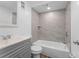 Bathroom with neutral tile, a shower-tub combination, and modern vanity at 1700 Azalea Ct # B, Oldsmar, FL 34677