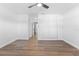 Neutral bedroom featuring a ceiling fan, closet and wood-look floors at 1700 Azalea Ct # B, Oldsmar, FL 34677