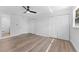 Spacious bedroom featuring modern ceiling fan, double closet, and ensuite bathroom with tile floors at 1700 Azalea Ct # B, Oldsmar, FL 34677