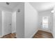 Bright entryway featuring tile-look floors, neutral paint, a closet and a storm door at 1700 Azalea Ct # B, Oldsmar, FL 34677