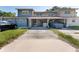 Inviting townhome with a covered carport, well-maintained lawn and vibrant landscaping at 1700 Azalea Ct # B, Oldsmar, FL 34677