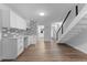 Eat-in kitchen featuring white cabinets, subway tile backsplash, quartz counters, and stainless appliances at 1700 Azalea Ct # B, Oldsmar, FL 34677